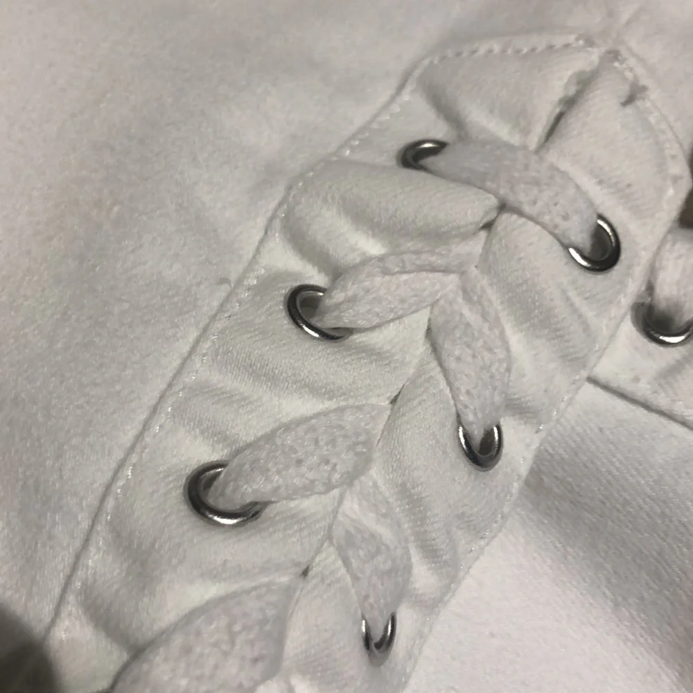Cute summer white jeans with lace up, rivets at the hem.  Size 10 - Picture 2 of 8